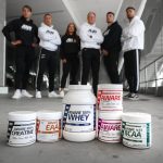 group of people standing on white floor tiles