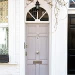 white wooden door mounted white wall